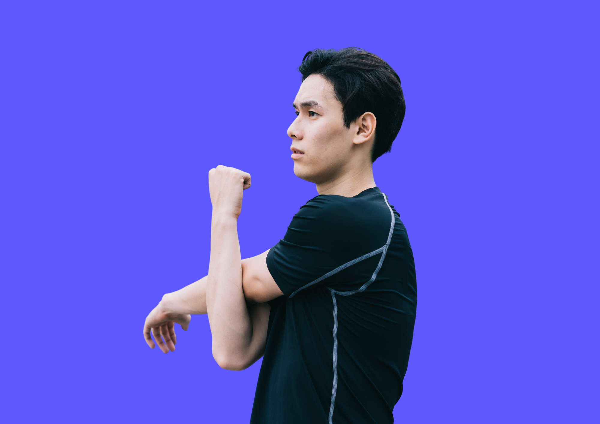 Young man is stretching his arm and shoulder. Blue background.
