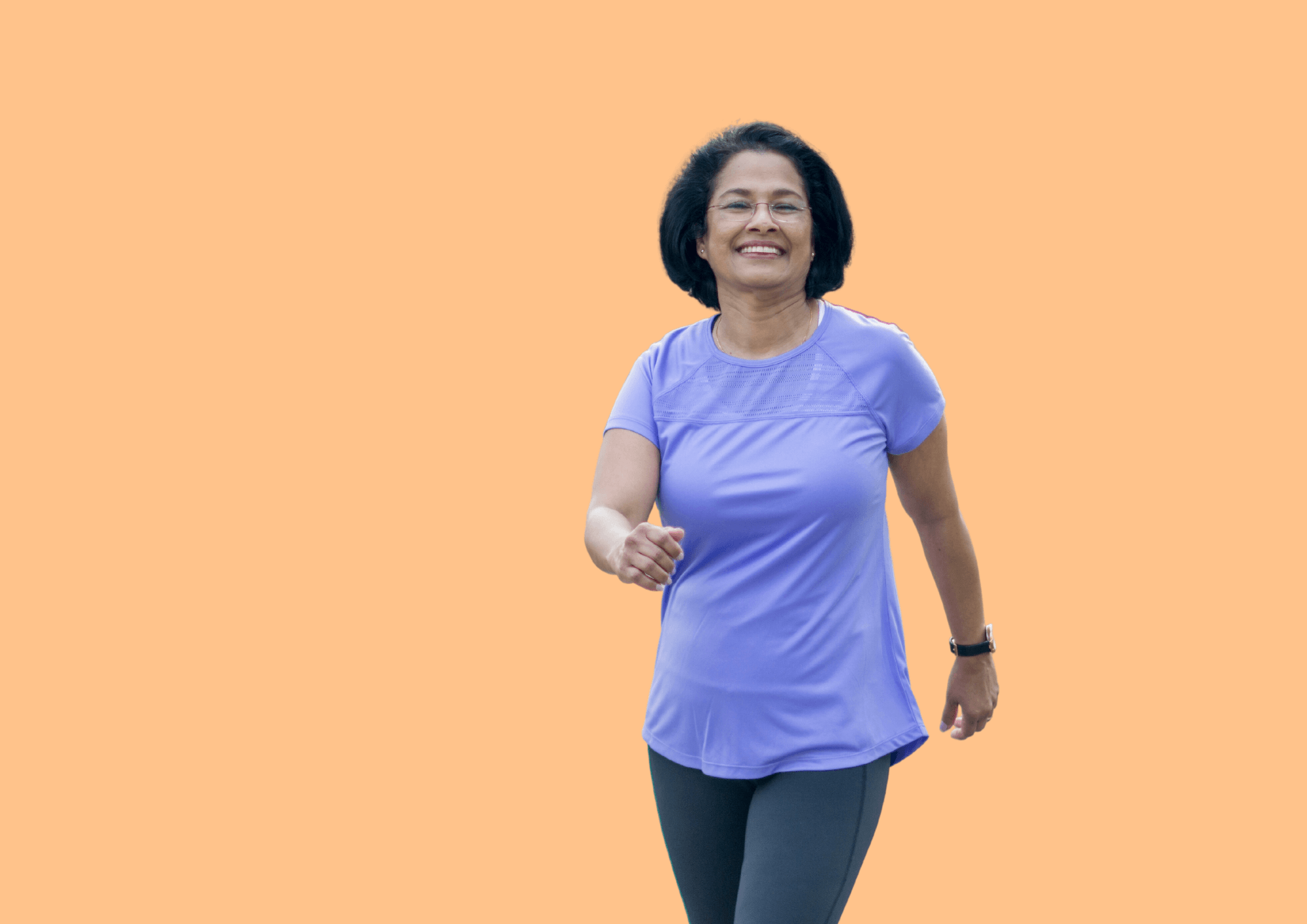 Middle aged woman is walking at a fast pace as exercise.