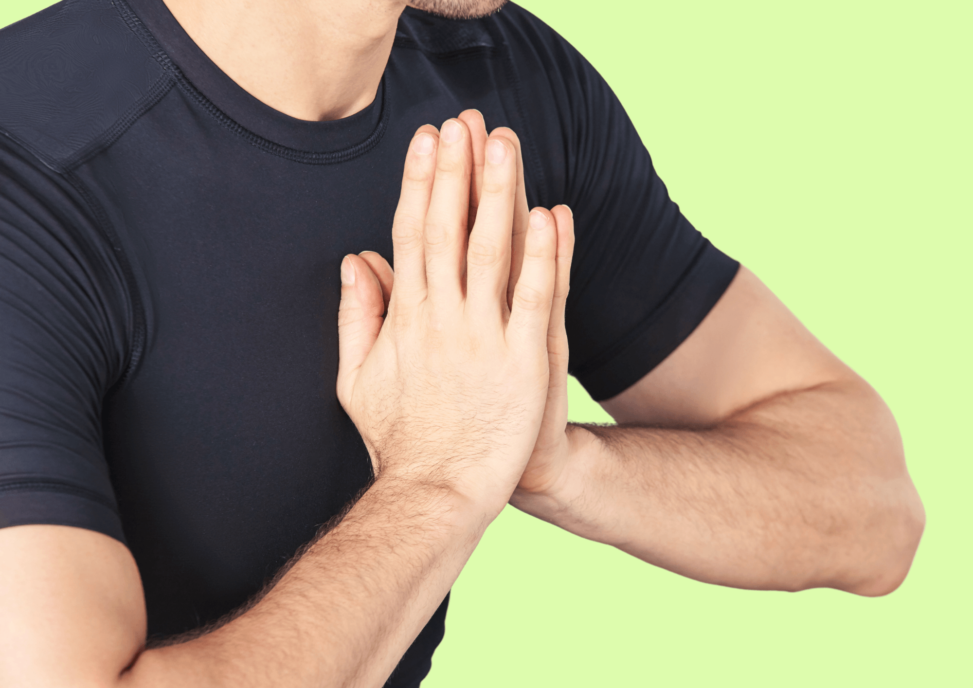Man is holding his hands together in a praying pose.