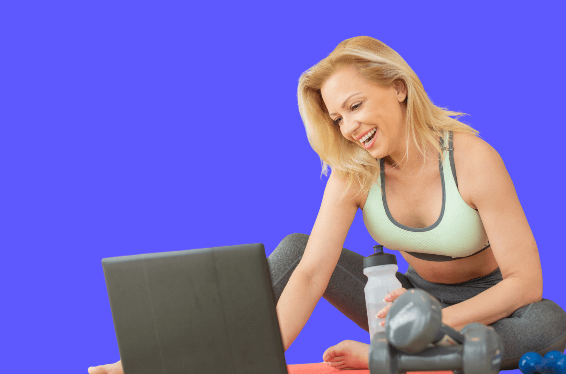 Woman is using RTM on her laptop to workout at home.