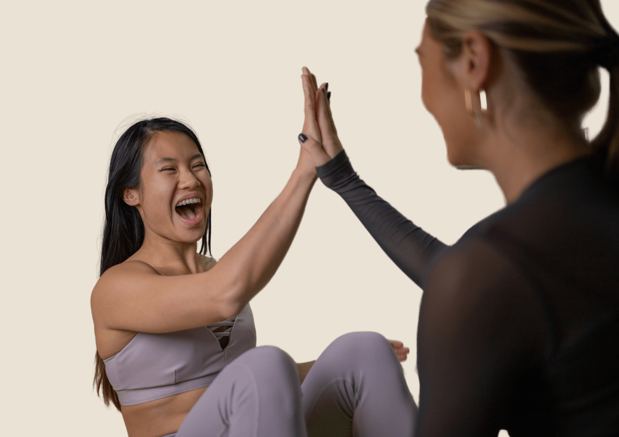 Patient and therapist high five after successful workout.