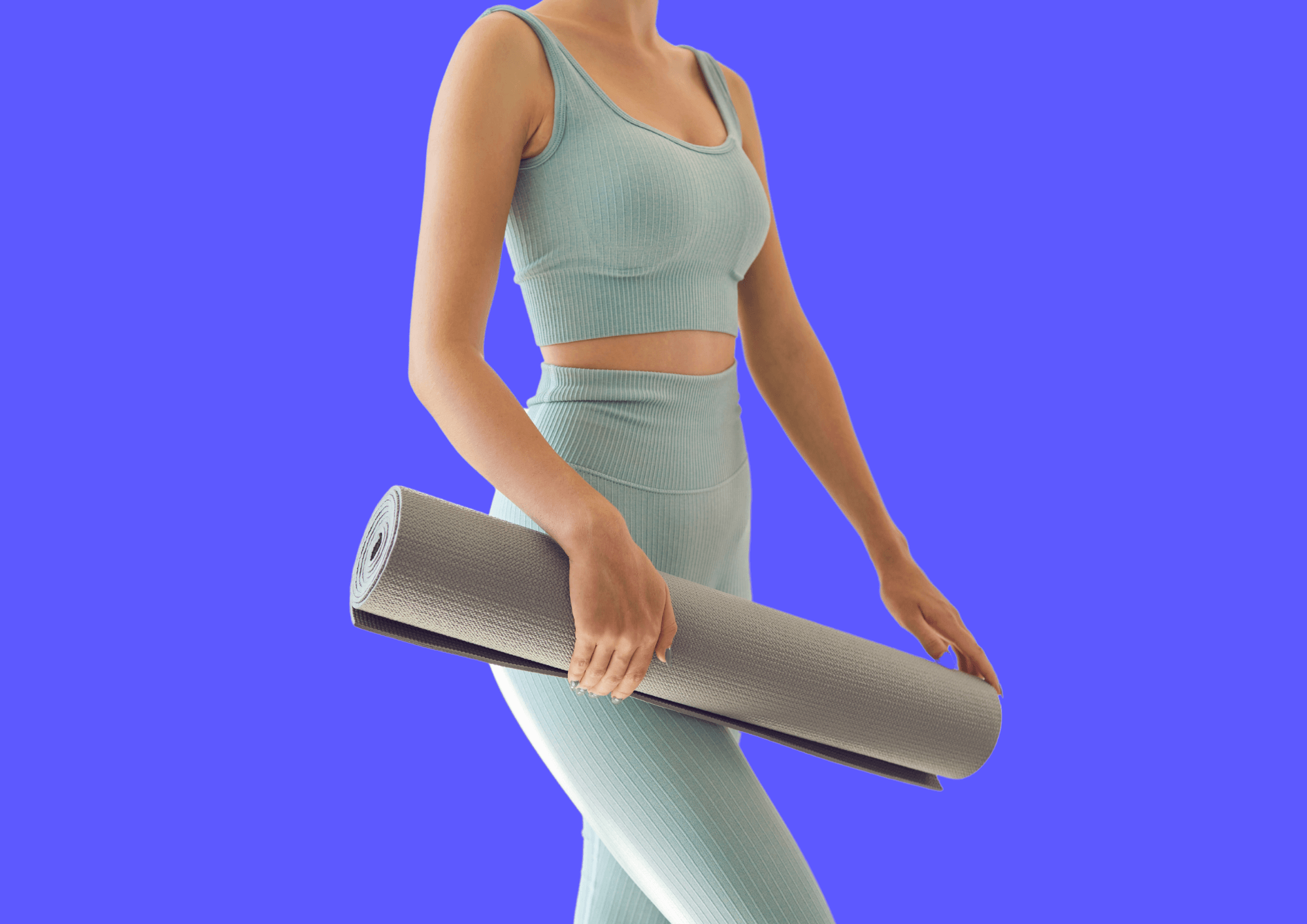 Woman is carrying yoga mat for Akina home workout.