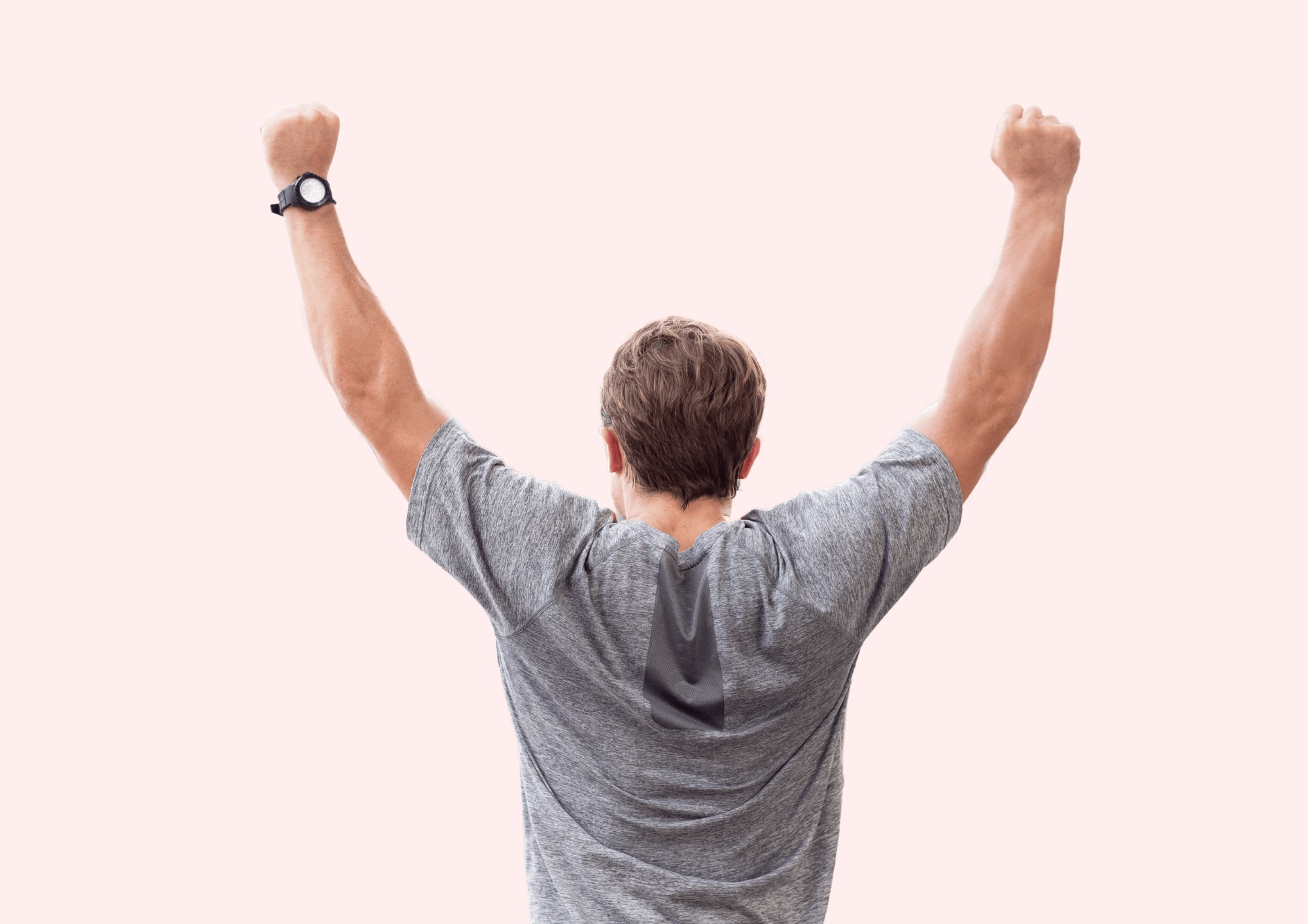 Sporty man is celebrating with his arms in the air. Pink background.