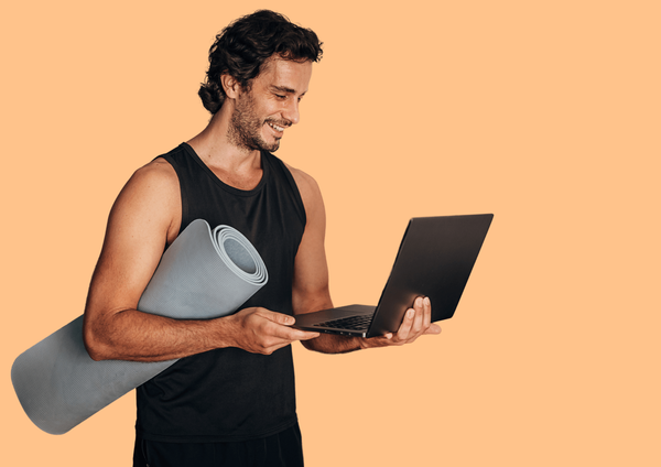 Man holds laptop with Akina platform in one hand, a yoga mat in the other.