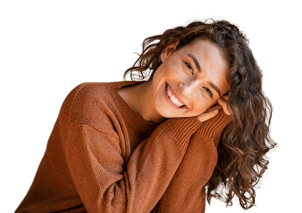 Holistically healthy woman smiling at camera.